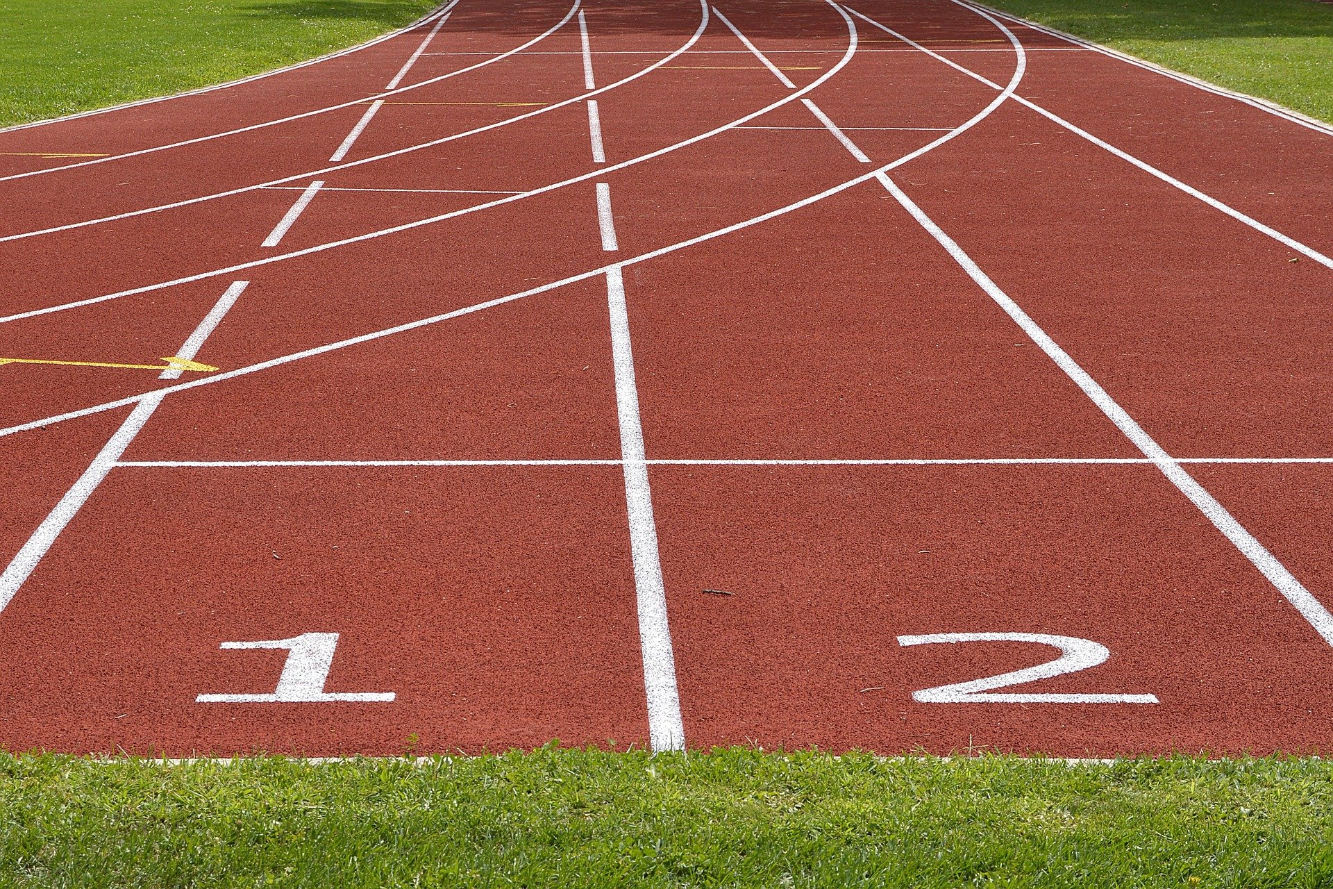 An athletic racetrack showing lane 1 and lane 2.