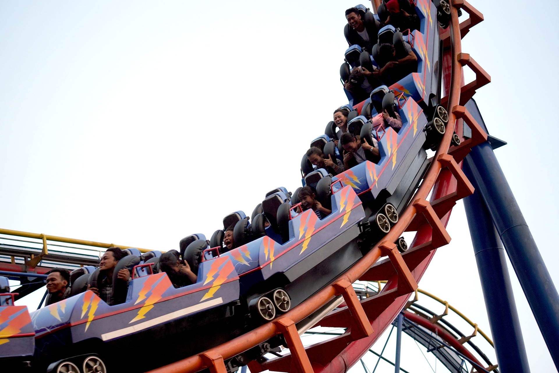 People on a rollercoaster ride.