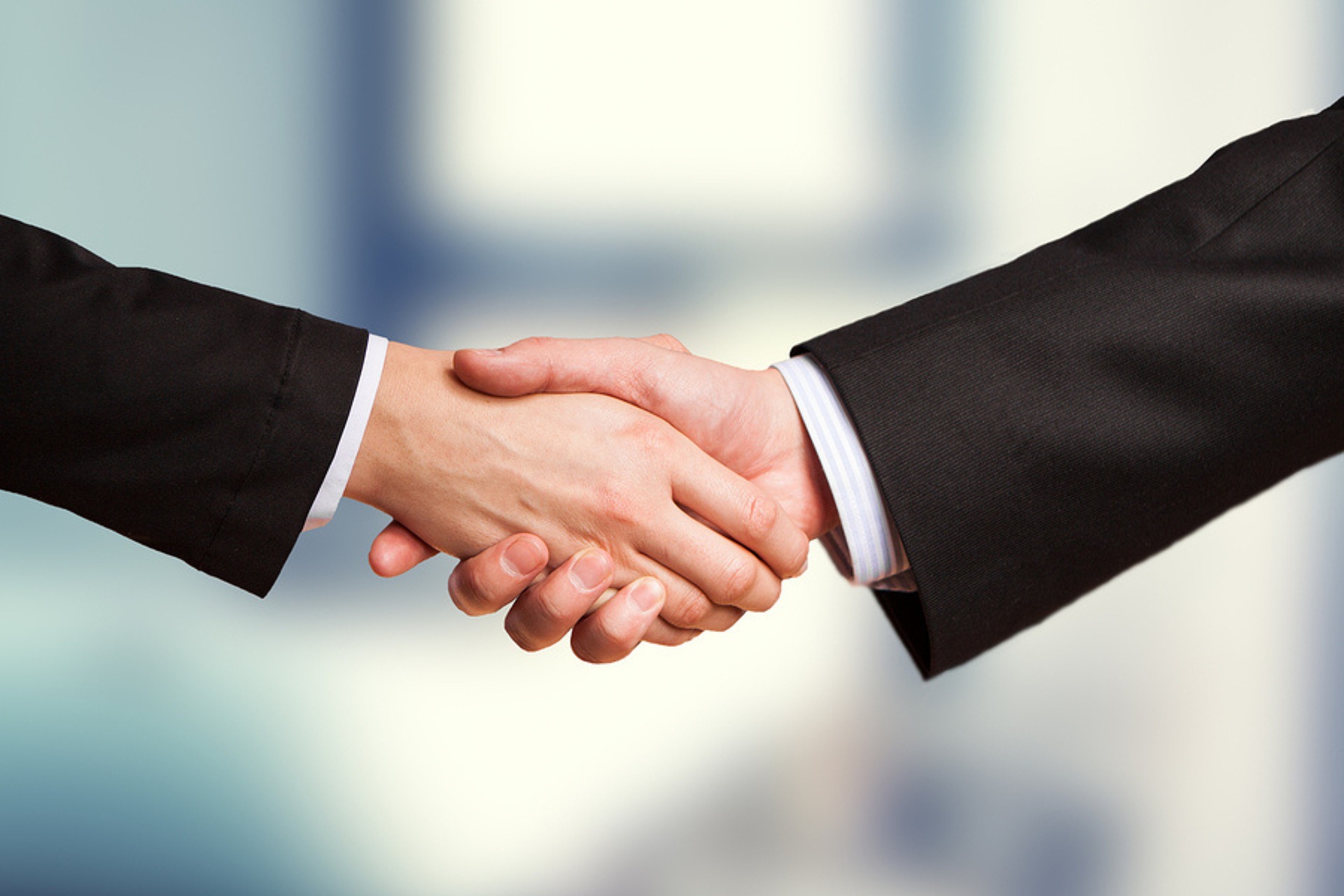 Businesspeople shaking hands.