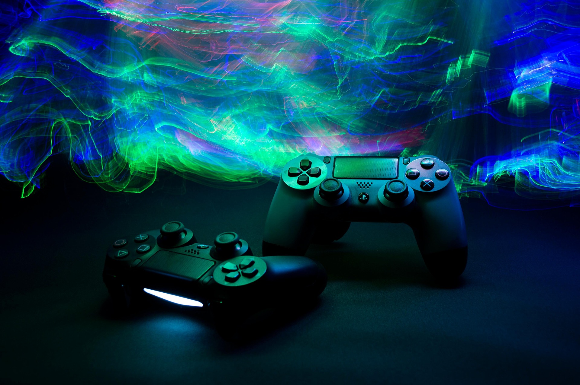 Gaming controllers with a futuristic background.