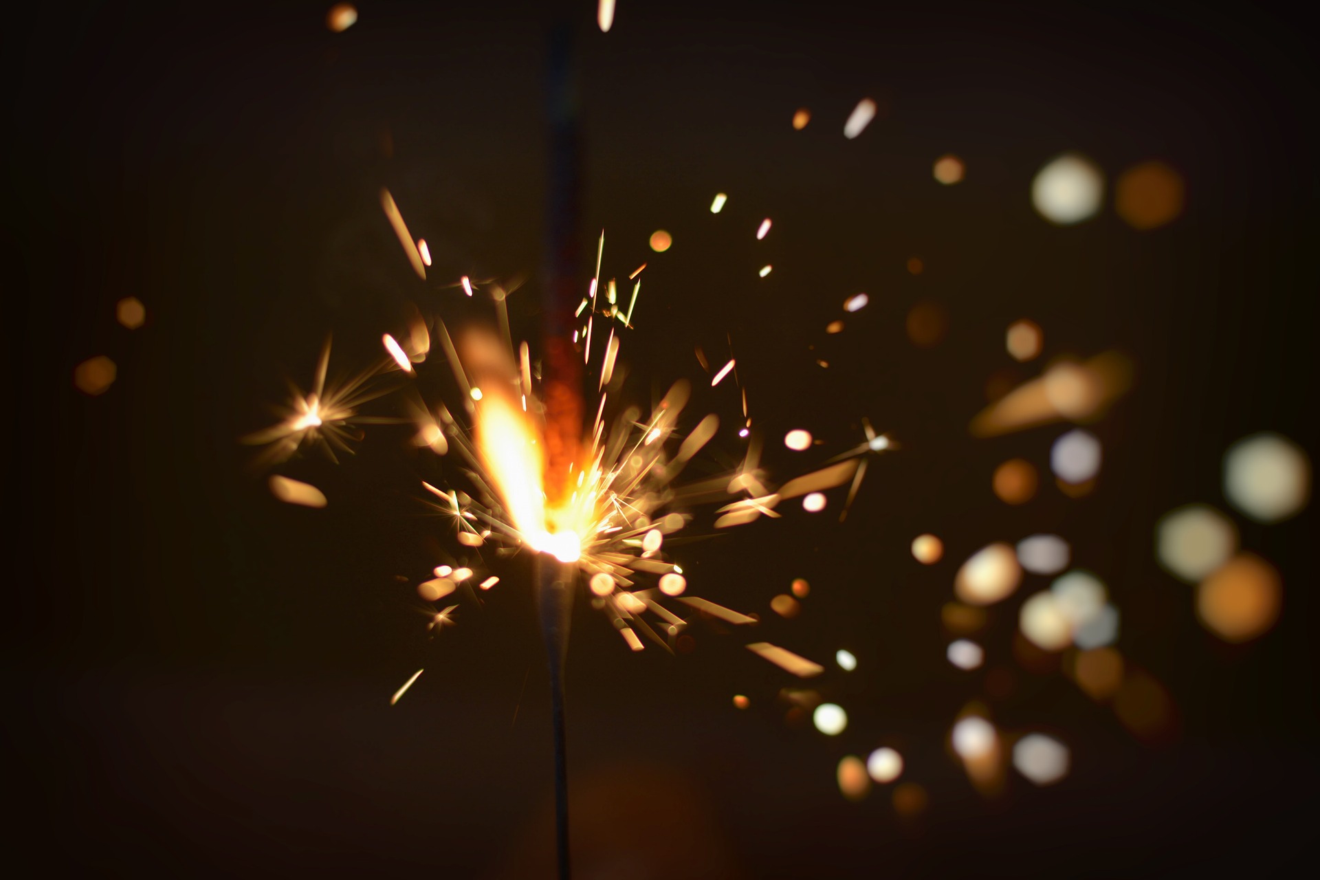 A sparkler shooting off sparks and light.