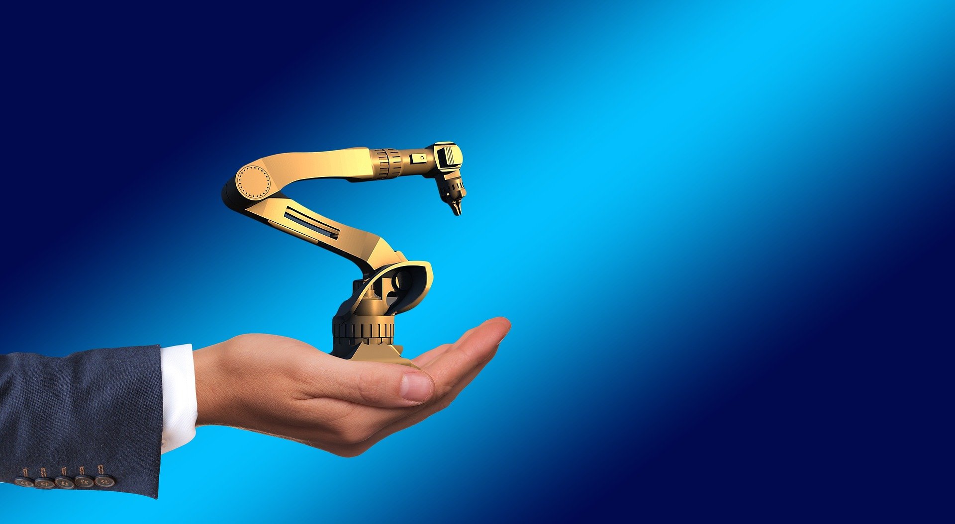 Human hand holding out a cybernetic robotic arm tool.