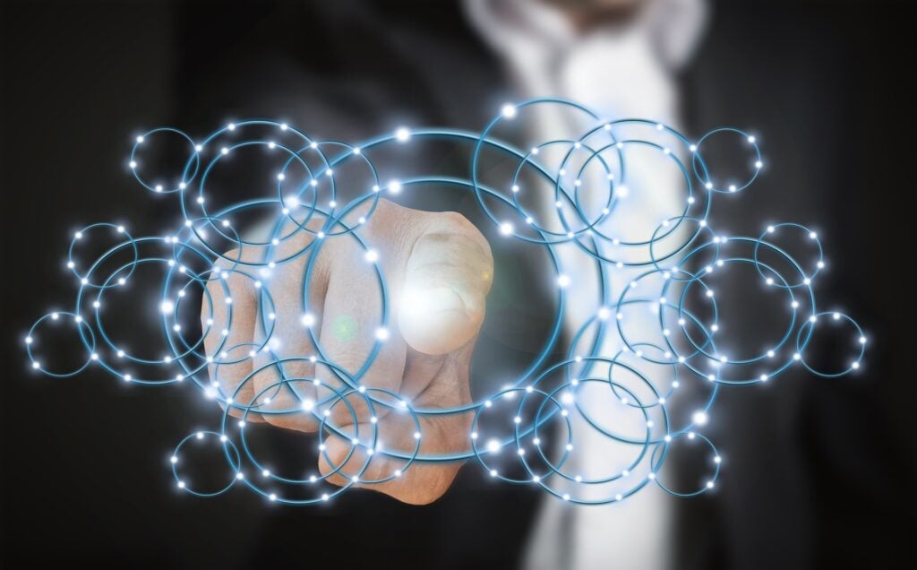 Technology development, person pressing a virtual screen button.