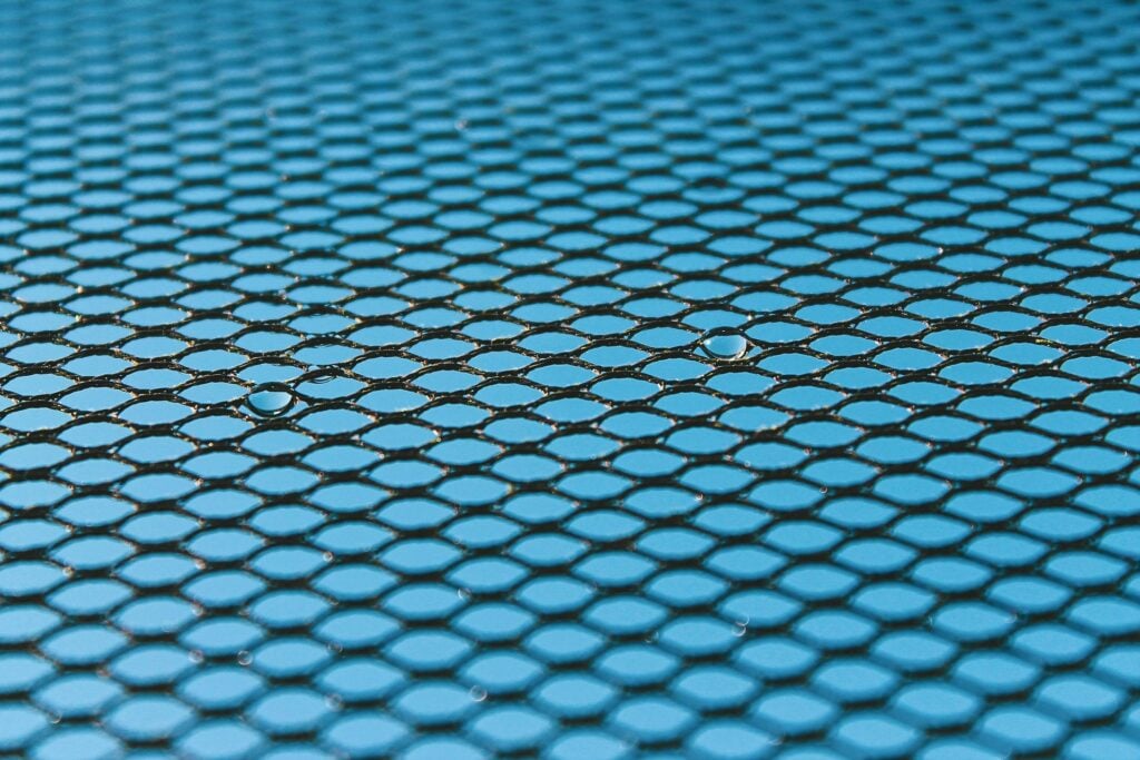 A textile tile pattern with two spots standing out as drops of water.