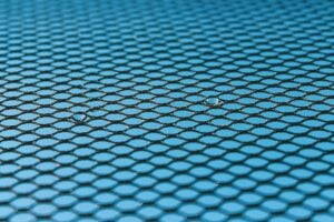 A textile tile pattern with two spots standing out as drops of water.