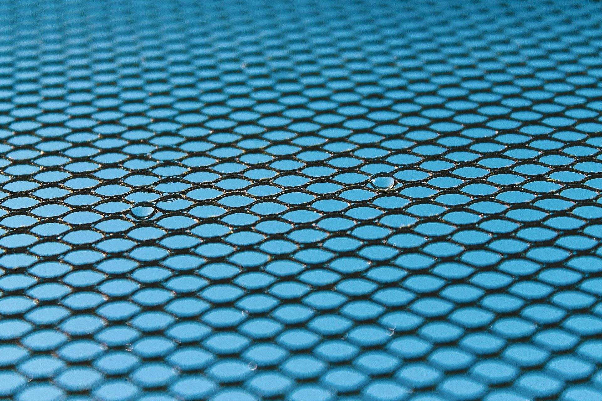 A textile tile pattern with two spots standing out as drops of water.