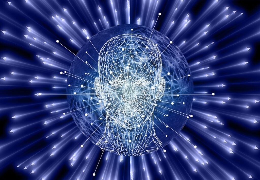 A data point/robotic looking head surrounded by artificial intelligence beams.