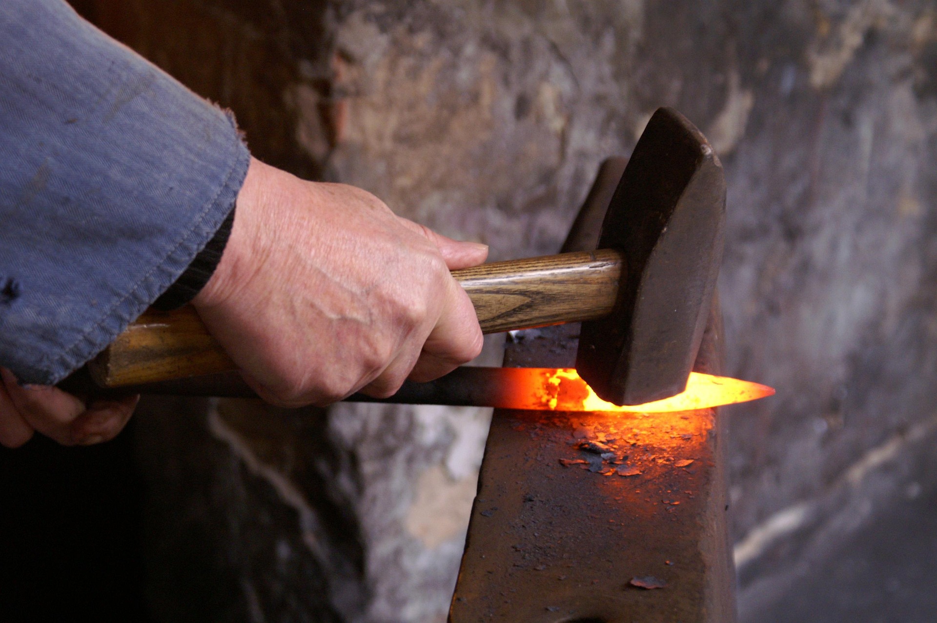 Hammering on a forge.
