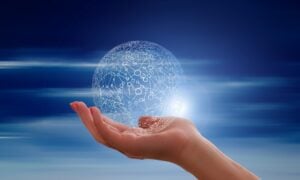 A outstretched hand holding a data sphere.
