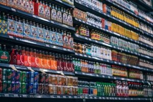 Retail merchandising aisle showing a wide range of beverages.