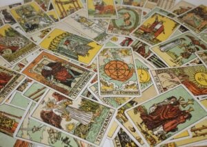 A variety of tarot cards spread out across a table.