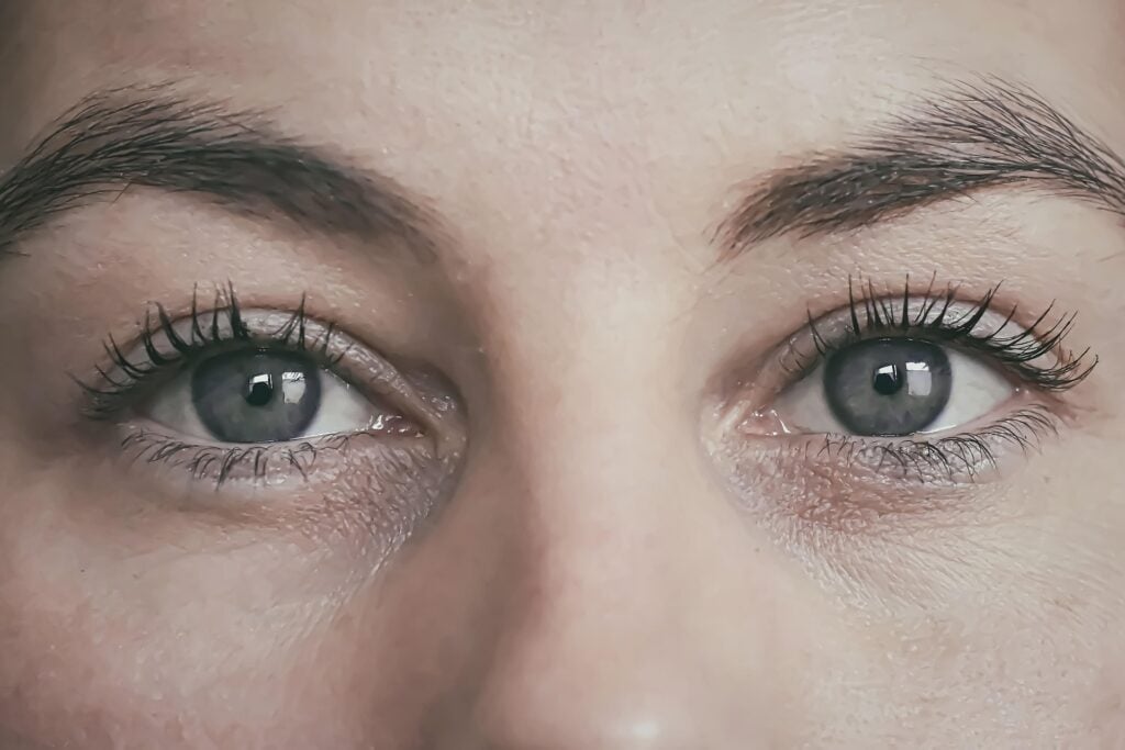 A close up of the eyes and face of a woman.