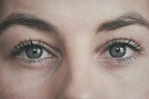 A close up of the eyes and face of a woman.