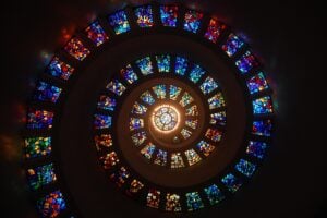 A stained-glass window spiraling from a center outward.