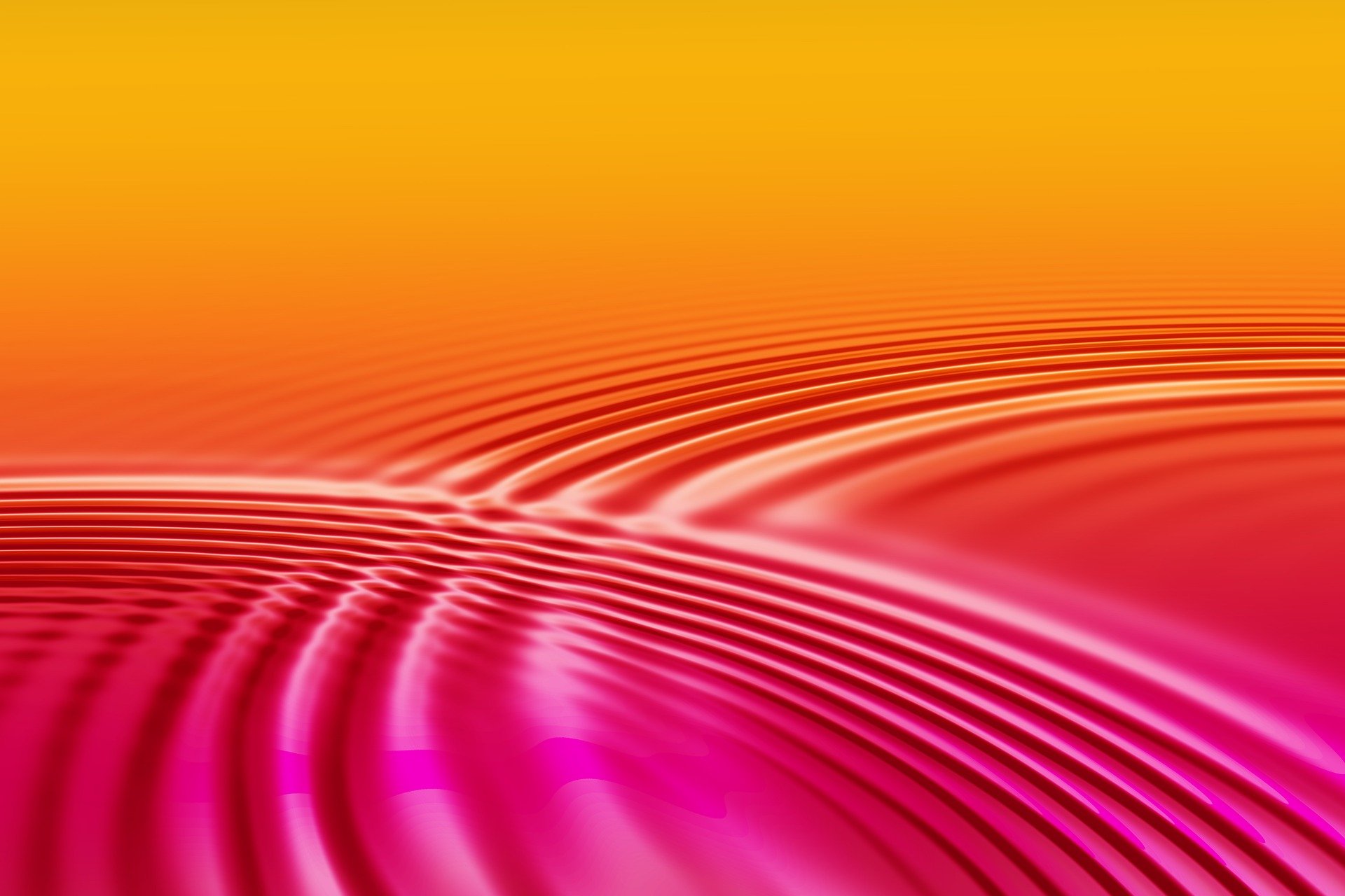 Concentric circles or waves/ripples of water on a light orangey background.