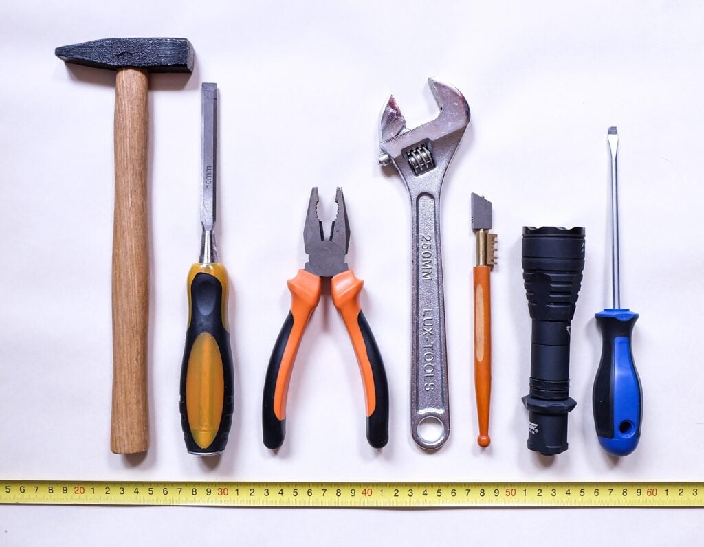A grouping of hand and hardware repair tools together.