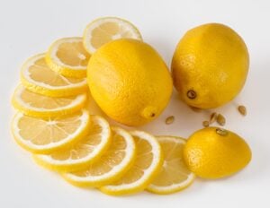 Lemons presented with it all sliced up into different segments.