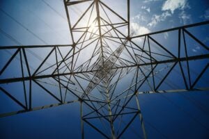 Angled perspective of a radio or signal tower with cables stretching out in all directions.